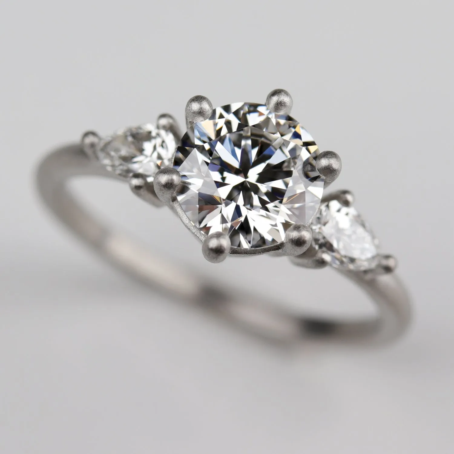 Prong-set Three Stone Ring with Recycled White Diamond