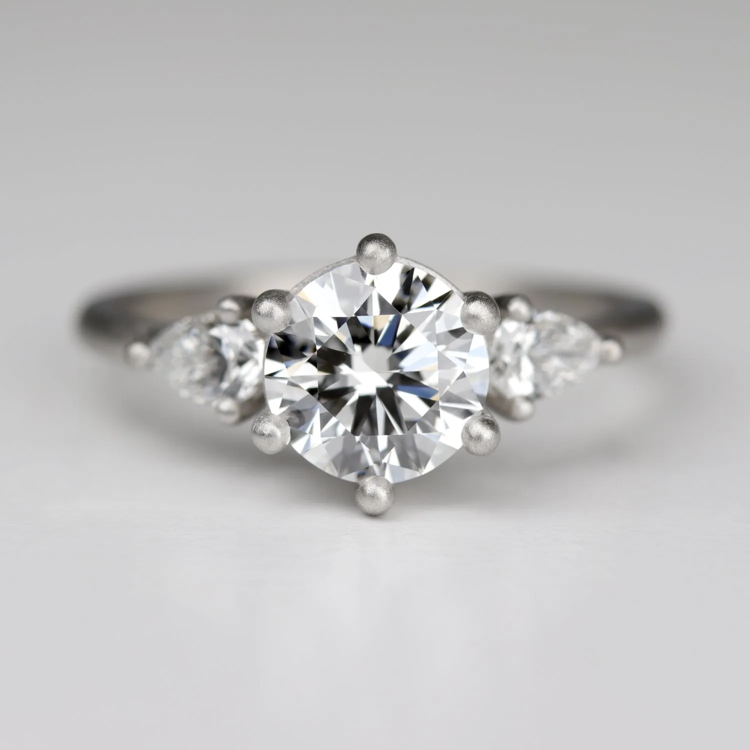 Prong-set Three Stone Ring with Recycled White Diamond