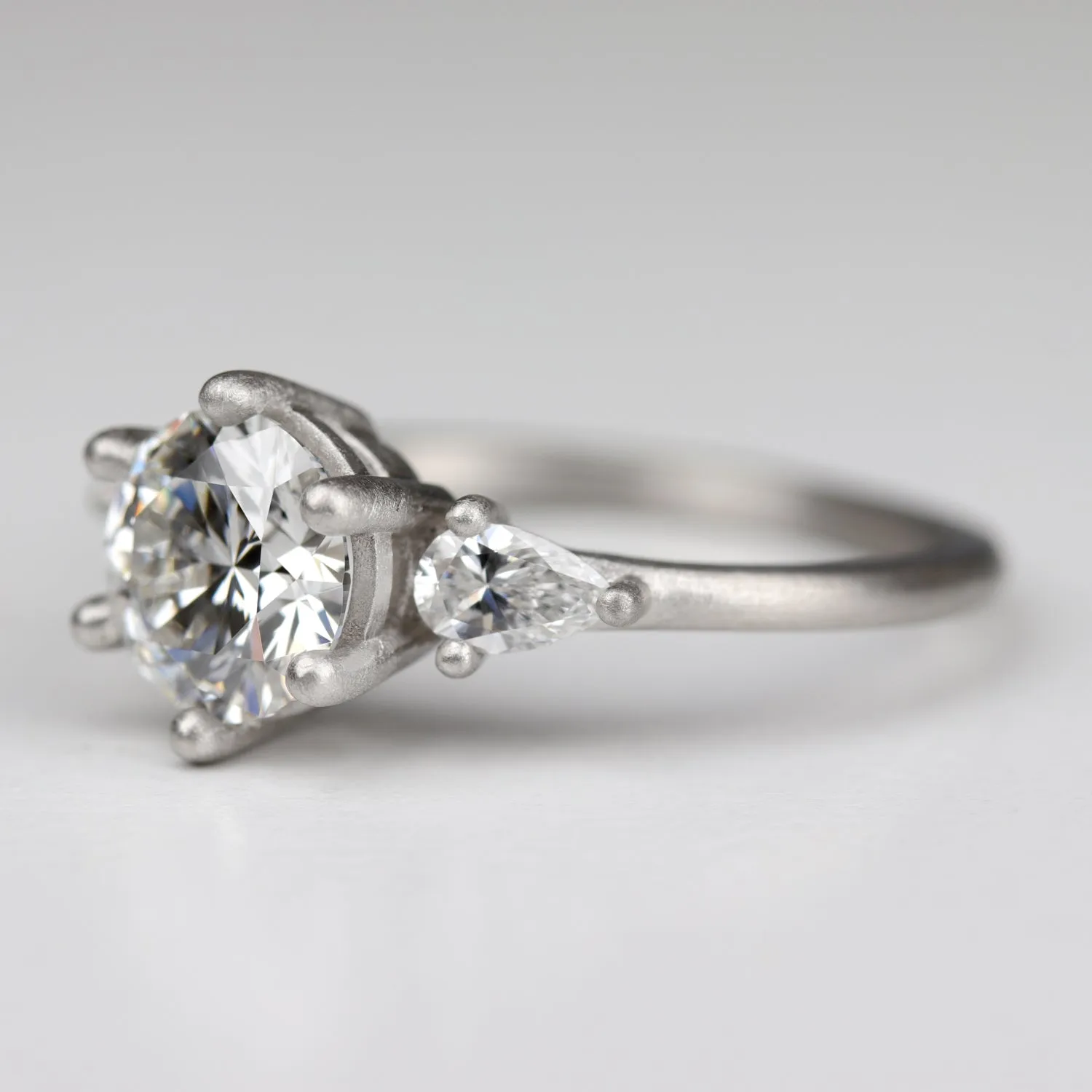 Prong-set Three Stone Ring with Recycled White Diamond