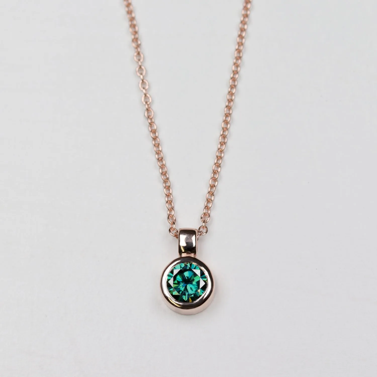 Round Bezel Set Pendant with Green Moissanite