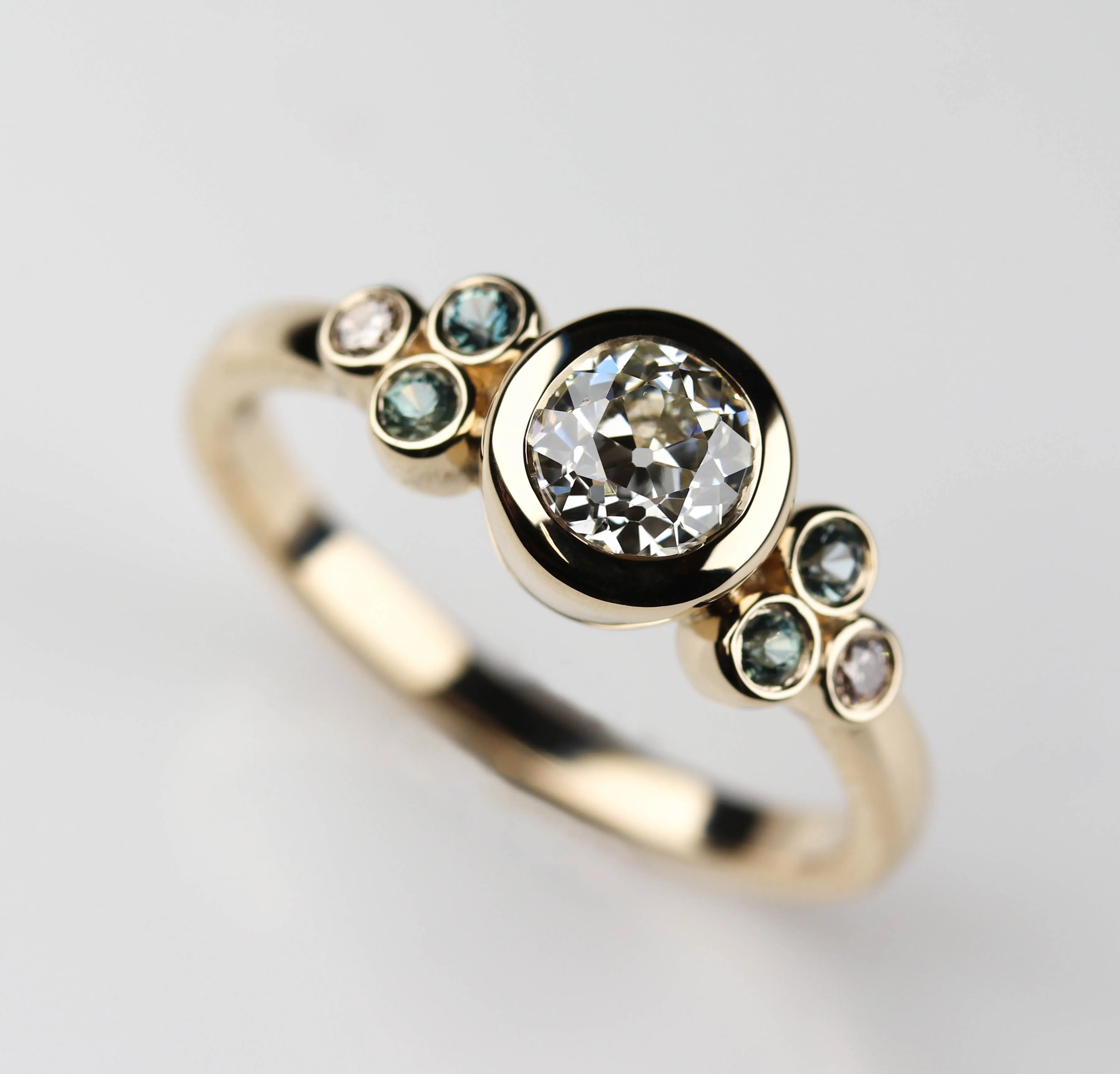 Seven Stone Bezel Set Cluster Ring with Heirloom Center Stone